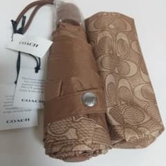 「新品未使用タグ付き]COACH 折りたたみ傘 晴雨兼用 シグネチャー柄 茶のサムネイル