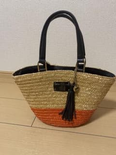 Paris La Bagagerie orange bicolor basket bag with tassel charm