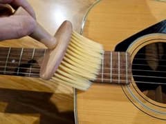 Guitar, bass, violin, and string instrument cleaning brush
