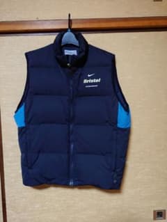F.C.R.B. × NIKE × meanwhile ダウンベスト - メルカリ