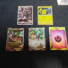 Pokémon card set including M Rayquaza EX, Pikachu, and 5 other cards.