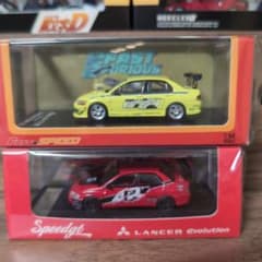 三菱 ランサーエボリューション イエロー レッド ミニカー - メルカリ