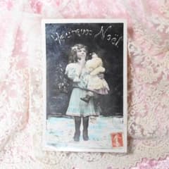 アンティークポストカード クリスマスのお人形を抱く可愛い少女 - メルカリ