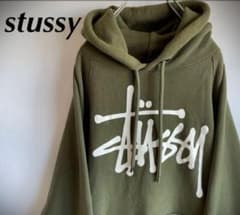 stussy スウェットパーカー デカロゴ 古着 1番人気カラー カーキ系のサムネイル