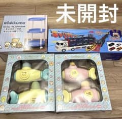 Unopened toy bundle: San-X water gun, 2-tier wagon, and car carrier (4 items total)
