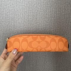 コーチ オレンジ ペンケース - メルカリ