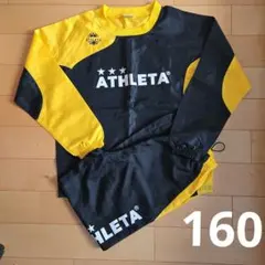 ATHLETA ピステ・ウィンドブレーカーセット 黒/黄