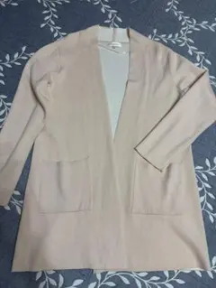 薄ピンクの カーディガン ポケット付き