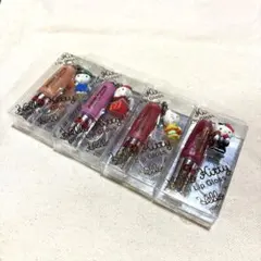 新品未使用　ハローキティ　ケータイリップグロス　キティマスコット付きのサムネイル