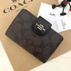 COACH 二つ折り財布 レオパード柄 - メルカリ