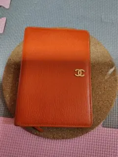 CHANEL 財布オレンジ 二つ折り財布 手帳型タイプ