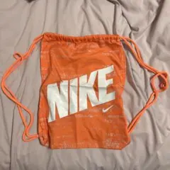 NIKE オレンジ ナップザック ロゴ入り