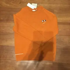 オレンジ 目デザイン ニットセーター