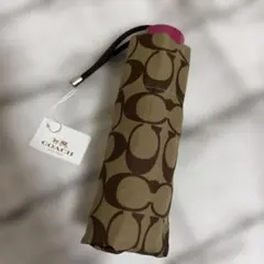 コーチ シグネチャー柄 ミニ折りたたみ傘 ピンクのサムネイル