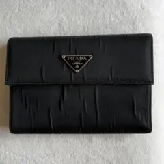 PRADA ラウンド ファスナー 長財布 1ML506 サフィアーノ レザー黒赤