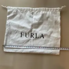 FURLA フルラ 保存袋 巾着袋 ポーチ ホワイト 布製 ロゴ入りのサムネイル