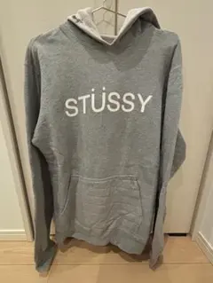 STÜSSY グレー フード付きパーカーのサムネイル