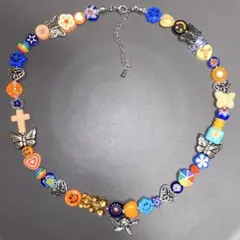 no300　オレンジ×蝶×天使　ネックレス