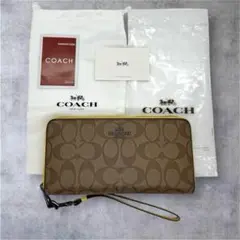 新品未使用 コーチ 長財布 ラウンド シグネチャー ストラップ付き ブラウン系