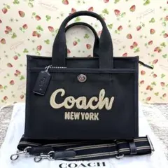 COACHコーチ大容量34リボン柄カーゴトートバッグ - メルカリ