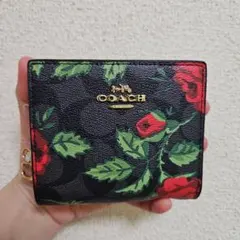 タグ付き COACH花柄2つ折りミニ財布