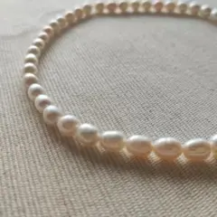 P565-10ミルキーホワイト淡水パールビーズ オーバル/ドロップ型約6-7mm