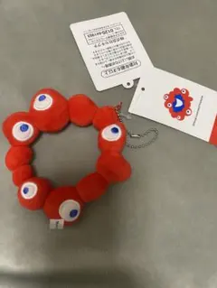 ミャクミャク カバンに付けられるぬいぐるみ ロゴ