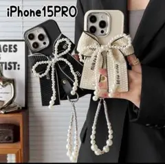 スマホケース iPhone15Pro リボンモチーフ パール ストラップ 黒