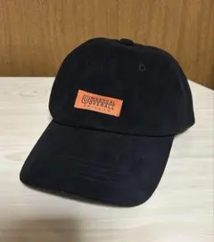 UNIVERSAL OVERALL キャップ ブラック オレンジタグ