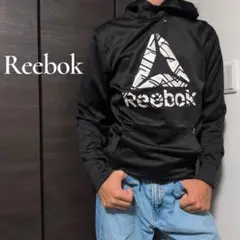 Reebok 薄手 デルタロゴ グラフィカルプリント プルオーバーパーカー