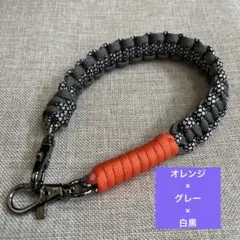 【Handmade】パラコード スマホハンドストラップ　グレーオレンジ白黒MIX