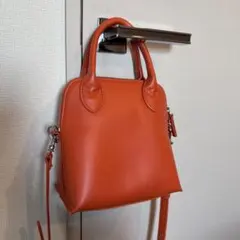 アダムエロペ　オレンジ　ハンドバッグ
