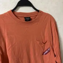 オレンジ 長袖カットソー ポケット付き