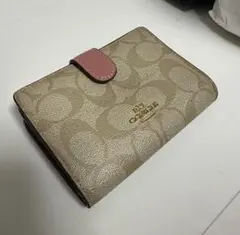 COACH 二つ折り財布 シグネチャー ピンク