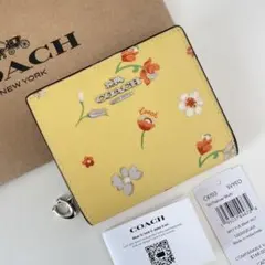 COACH コーチ　折り財布　イエロー　黄色　花柄　ミニウォレット COACH コーチ 折り財布 イエロー 黄色 花柄 ミニウォレット - メルカリ