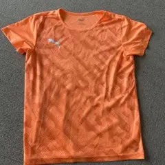 Puma オレンジ パターン入り シャツ　160