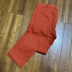オレンジ スリムフィットパンツ