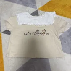 動物刺繍フリル襟ベージュトップス