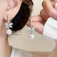 ピアス シルバー リボン ロング 揺れる 結婚式 ブライダル キラキラ