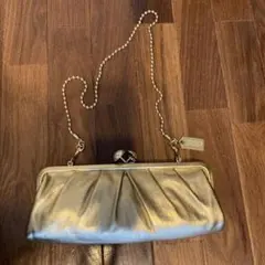 COACH ゴールド クラッチバッグ