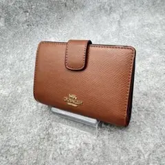 コーチ コンパクトウォレット ラウンドジップ シグネチャー レザー ブラウン