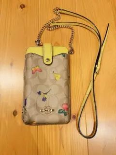 る*る様 海外限定 coach スマホショルダー 中古品 ハニービー 