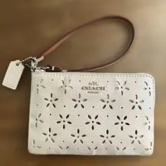 COACH 花柄パンチングポーチ