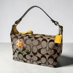 コーチ アクセサリーポーチ ハンドバッグ シグネチャー 花モチーフ フローラル