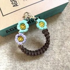 パラコード　ハンドスマホストラップ　☺︎ニコちゃん☺︎ お花　ハンドメイド