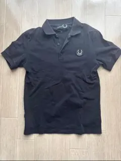 RAF SIMONS / ポロシャツ Raf Simons logo-plaque Cotton Polo Shirt | Black | FARFETCH