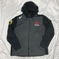 【新品】Reebok UFC コナー・マクレガー フーディ Lサイズ ブラック 新品】Reebok UFC コナー・マクレガー フーディ Lサイズ ブラック