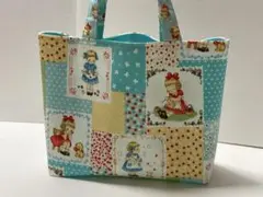 パッチワーク風柄のミニ手提げバッグ