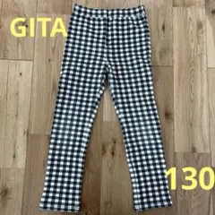 黒と白のチェック柄スリムフィットパンツ