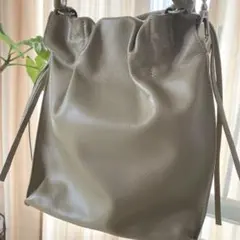 ALLSAINTS ハンドバッグ グレー タッセル付き - メルカリ